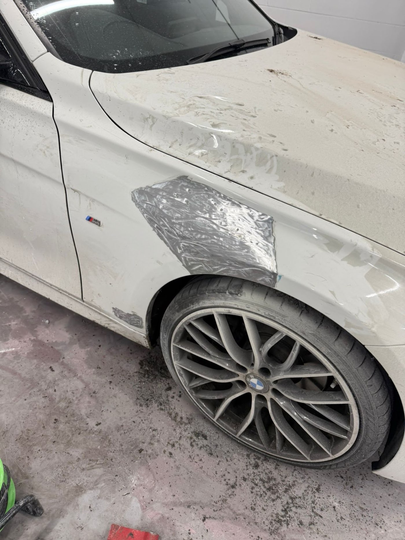 Car panel damage before repair at Haque Bodywork